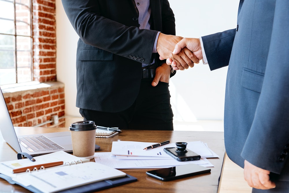 shaking hands after agreement image