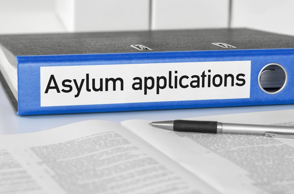 A blue folder with the label Asylum applications
